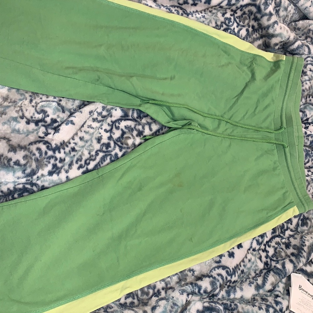 Y2k like green track suit pants.